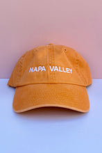 Load image into Gallery viewer, An orange baseball cap with 'NAPA VALLEY' embroidered in white across the front.