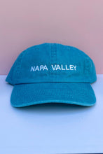 Load image into Gallery viewer, A bright blue cotton baseball cap with 'NAPA VALLEY' embroidered in white across the front.
